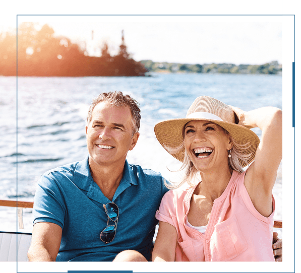 Happy couple enjoying a sunny boat ride on the water.